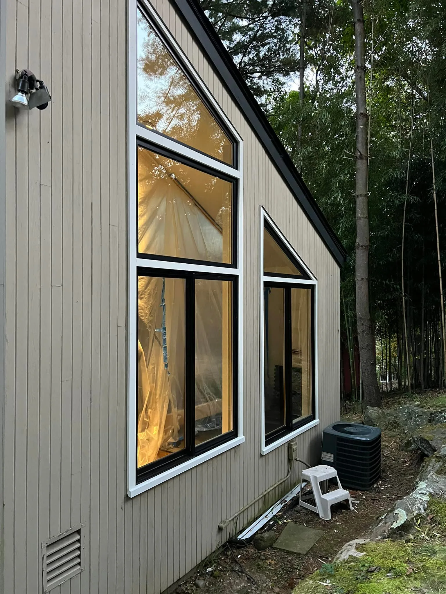 Final result of installed Andersen windonws with black and white trim.