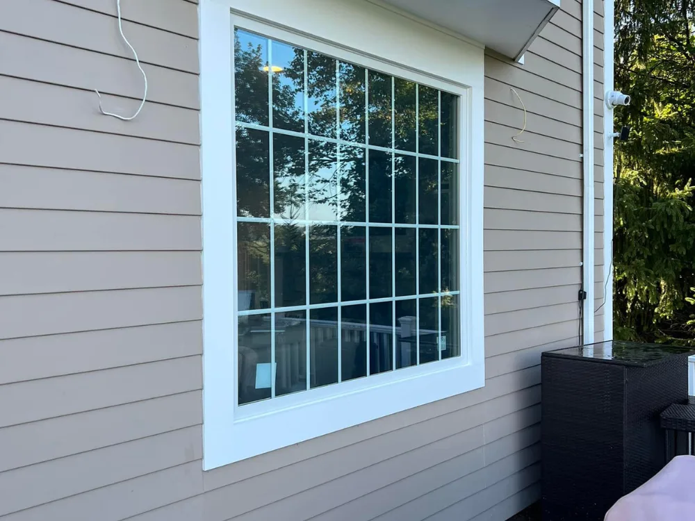 Final result: new Andersen picture windows installed after removing old door.