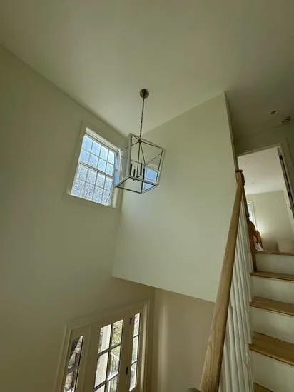 modern staircase with hardwood floor restoration