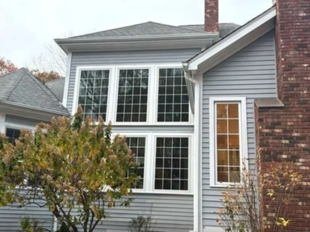 Exterior view of home before two-story custom window replacement